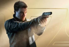 A man in a dark jacket aims a handgun against a golden backdrop featuring a stylized 007 logo.