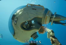 First-person perspective of a player repairing a damaged small submersible underwater with a handheld tool that is emitting sparks.