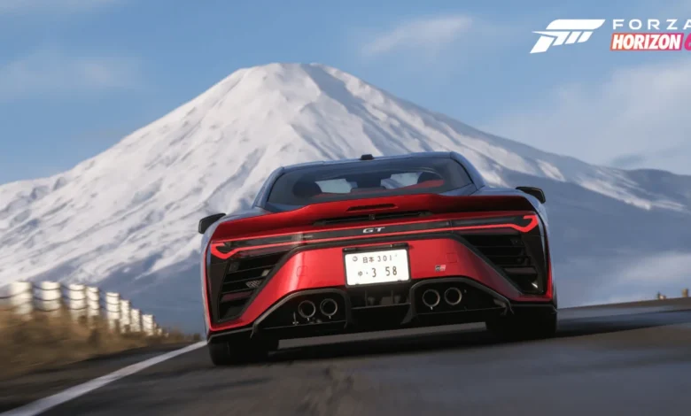 Rear view of a red sports car driving on an open road toward Mount Fuji in a promotional graphic for Forza Horizon 6.