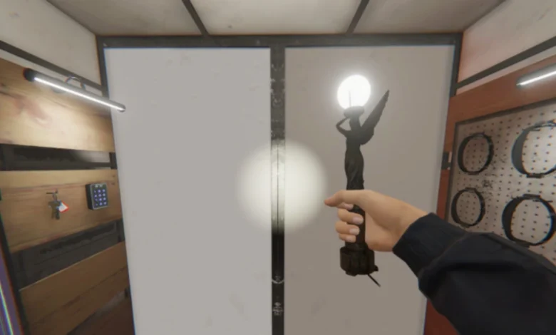 A first-person perspective of a hand holding a glowing angel statue inside a workshop or equipment room.
