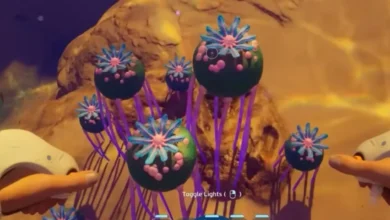 A first-person view of spherical, dark green alien plants with pink star-shaped flowers and long purple stalks in an underwater video game.