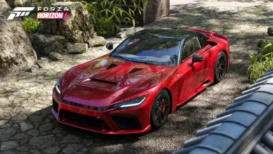 A sleek red sports car parked in a traditional Japanese garden with stone paths and lush greenery, featuring a Forza Horizon 6 concept logo.