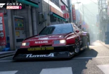 A red Nissan Skyline race car parked on a narrow, sunny Japanese city street with the Forza Horizon 6 logo in the corner.