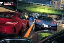 A red and a blue sports car speed through a neon-lit urban city at night under a green bridge in a scene from Forza Horizon 6.