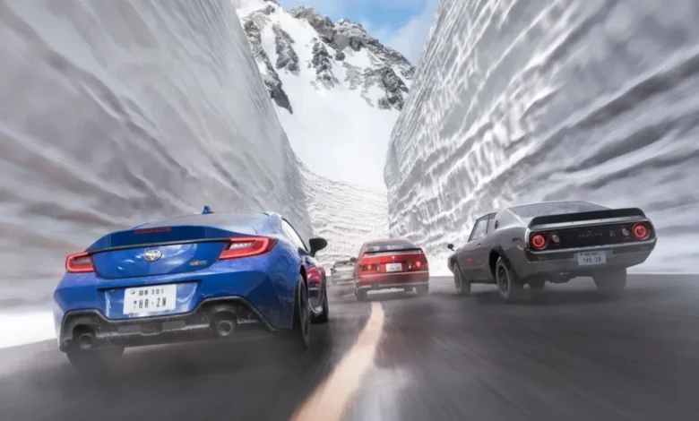 Several sports cars speed along a mountain road between towering walls of snow.