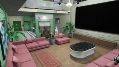A modern living room featuring pink sofas and a large black screen, with a green-accented kitchen and a loft visible in the background of this digital interior.