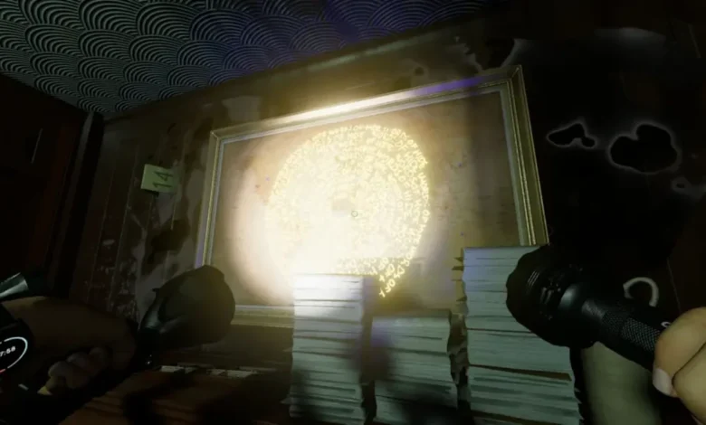 Flashlights illuminate a framed map in a dark room, revealing a glowing spiral of hidden text.