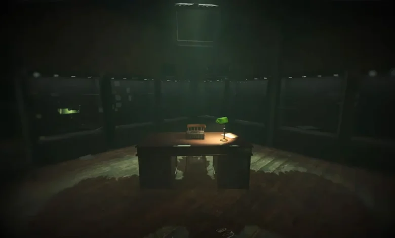 An illuminated desk featuring a typewriter and a green banker's lamp sits in the center of a dark, circular chamber surrounded by shadowy windows.