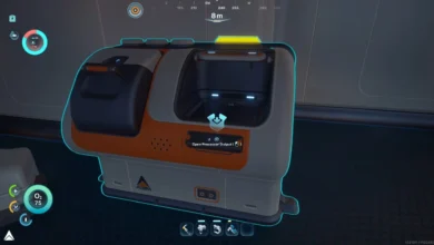 A futuristic white and orange processing machine from a first-person perspective video game, highlighted with a cyan outline and an interaction prompt.