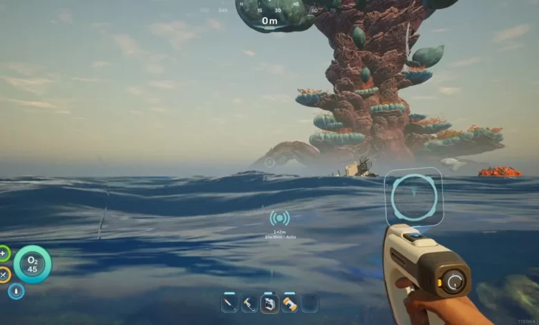 First-person perspective from an ocean surface looking toward a massive, coral-like alien structure rising from the water in a survival video game.