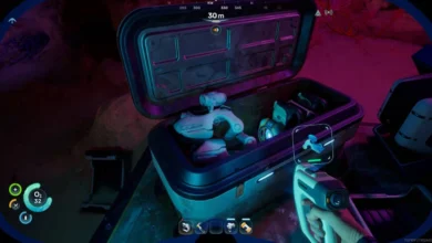 A first-person perspective from a video game showing an open storage crate filled with futuristic technology and robotic components inside a dimly lit cavern.