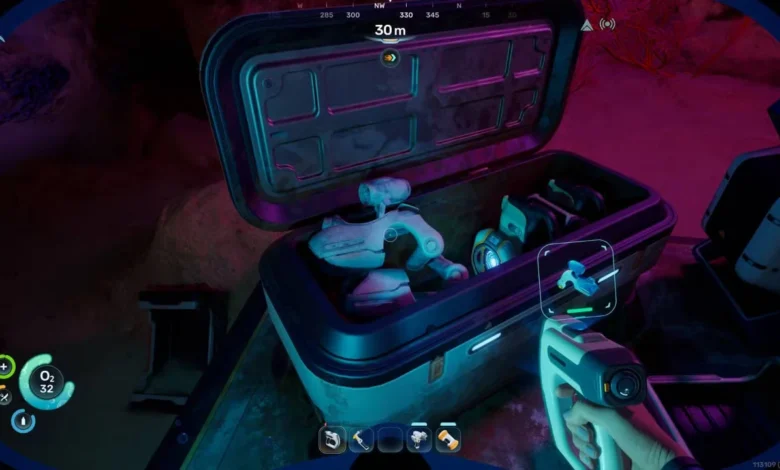 A first-person perspective from a video game showing an open storage crate filled with futuristic technology and robotic components inside a dimly lit cavern.