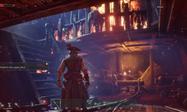 A pirate stands on the lower deck of a burning wooden ship, looking toward a staircase as fire engulfs the structure above.
