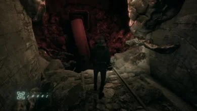 A lone figure stands on ruined tracks in a dark, cavernous tunnel facing a crashed subway car.
