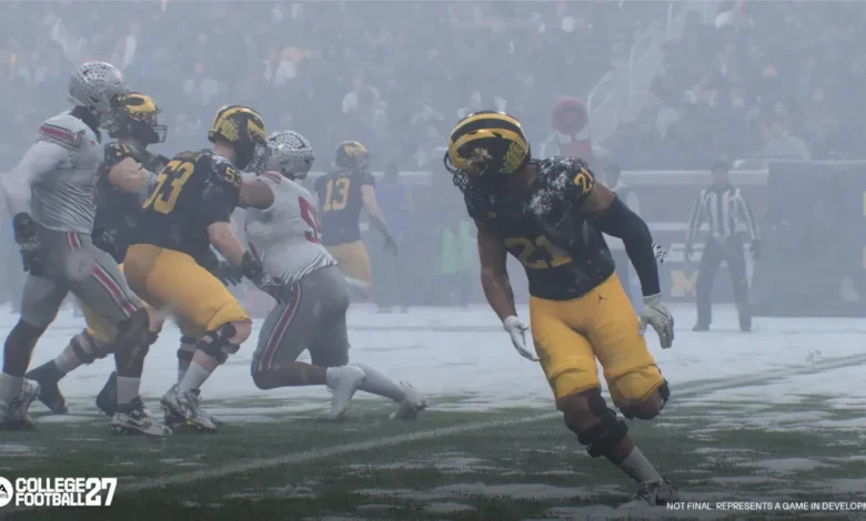 Michigan and Ohio State football players compete on a snow-covered field in a scene from the EA Sports College Football video game.