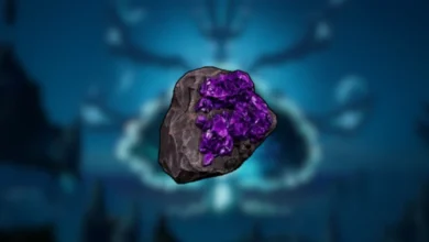 A dark grey rock embedded with vibrant purple crystals, centered against a blurred, glowing blue background.