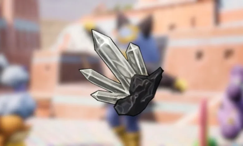 A cluster of pointed, translucent gray crystals growing from a dark rock base against a blurred anime-style background.