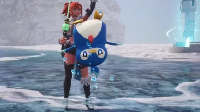 A red-haired character holds a blue, penguin-like creature upside down while standing on a beach in a video game scene.