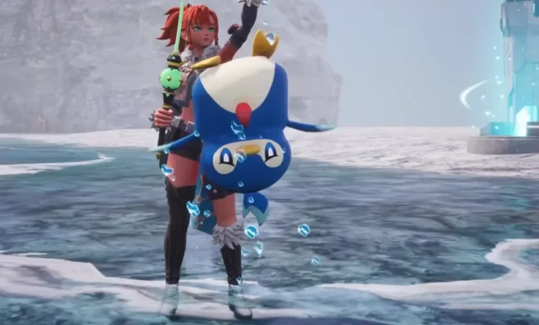 A red-haired character holds a blue, penguin-like creature upside down while standing on a beach in a video game scene.