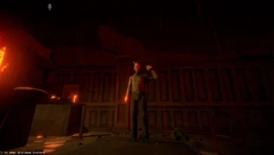 A video game character holds a gun to his head in a dark, red-lit room.